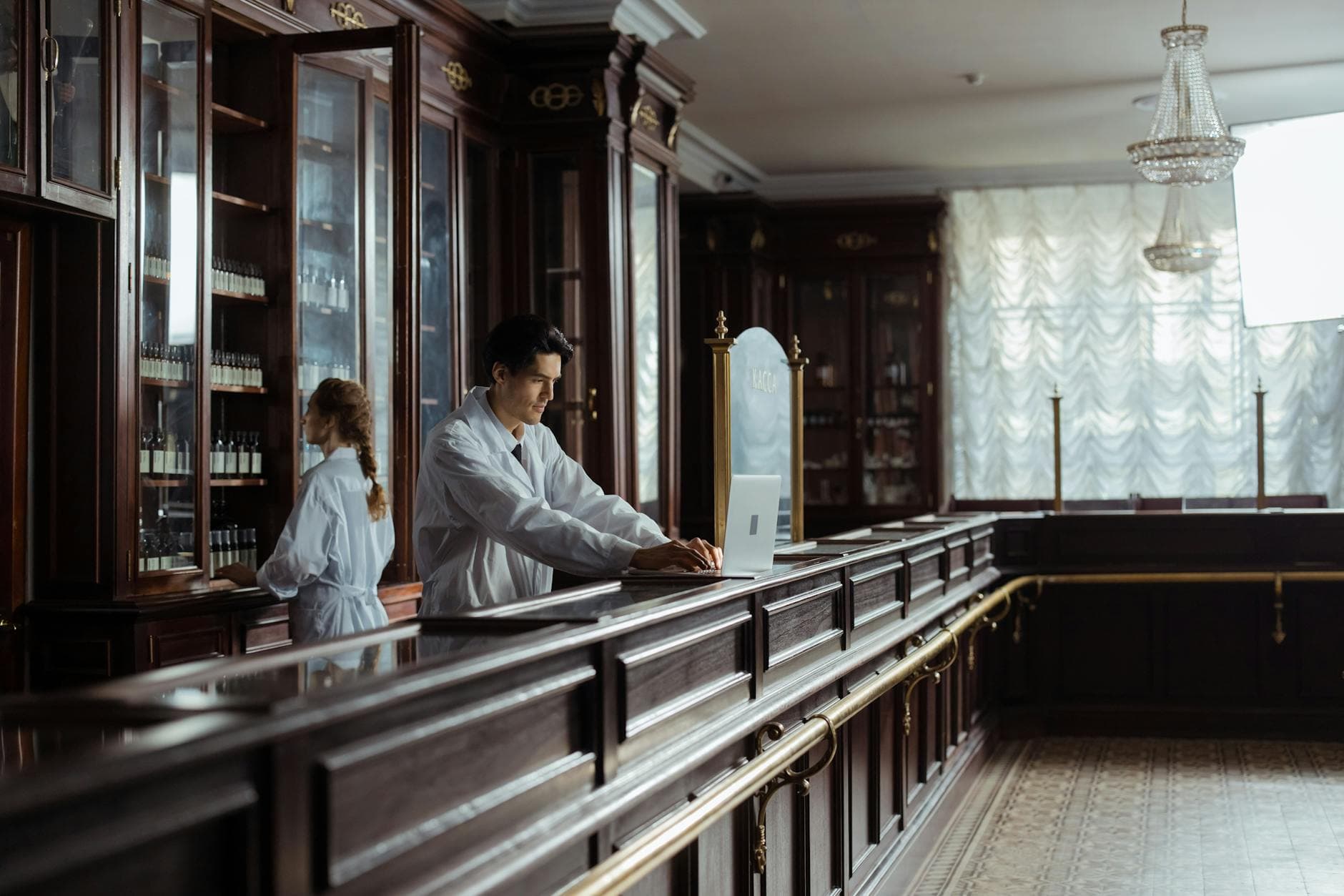 Pharmacist helping a customer at the counter